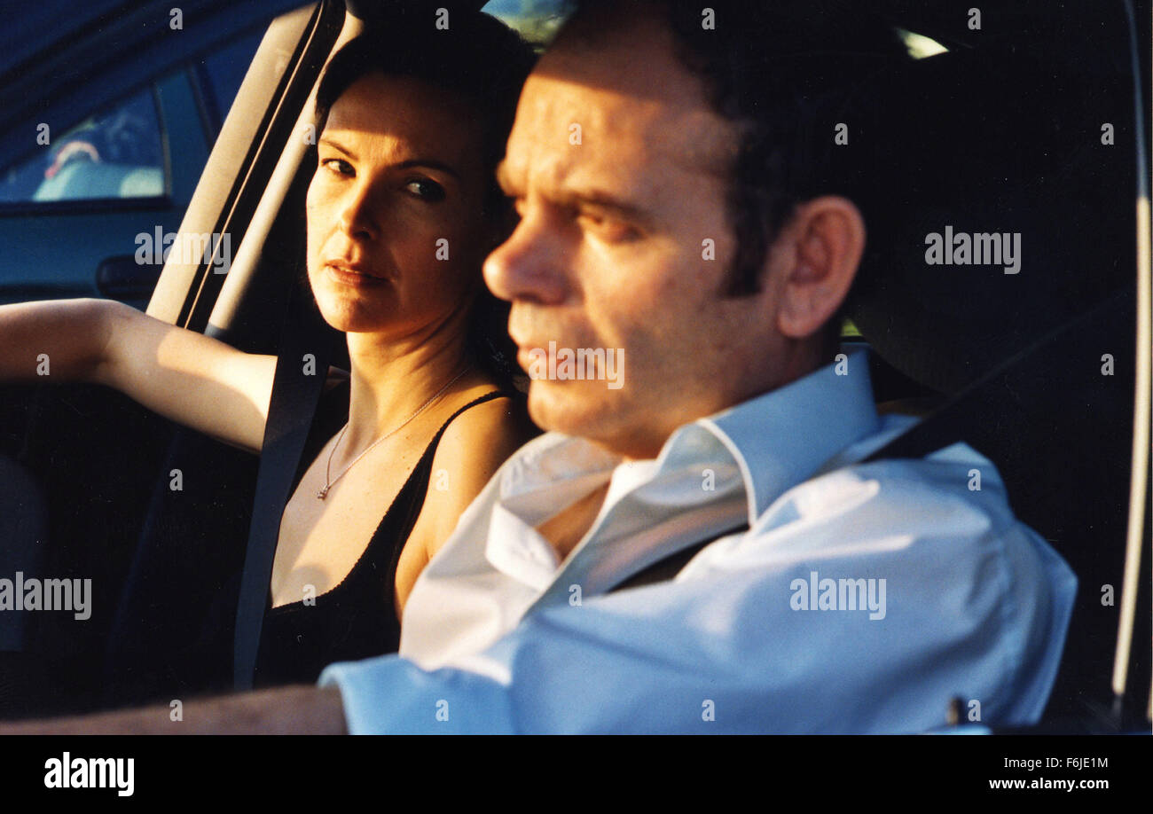 RELEASE DATE: May 24, 2004. MOVIE TITLE: Red Lights. STUDIO: Gimages. PLOT: Antoine and Helene drive to South France to return their kids from a holiday camp. The traffic is dense and the atmosphere growingly tense; he is an alcoholic and becomes increasingly drunk the more often they stop. After a fierce discussion they split and both have to face great danger during the night. PICTURED: CAROLE BOUQUET and JEAN-PIERRE DARROUSSIN star as Helene and Antoine. Stock Photo