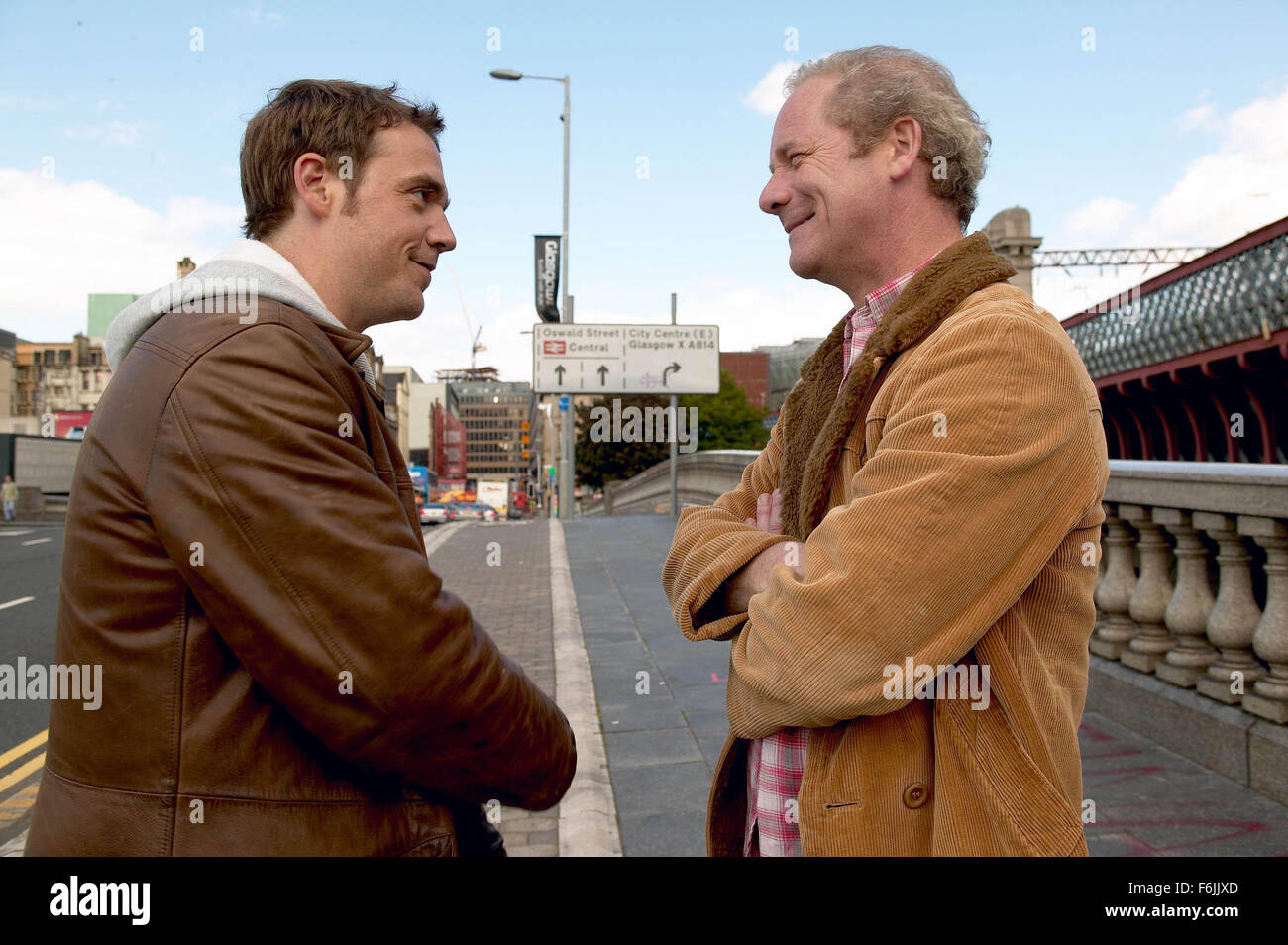 RELEASE DATE: January 2005. MOVIE TITLE: On a Clear Day. STUDIO: Baker Street. PLOT: Frank determines to salvage his self-esteem and tackle his demons by attempting the ultimate test of endurance - swimming the English Channel. PICTURED: JAMIE SIVES as Rob and PETER MULLAN as Frank. Stock Photo