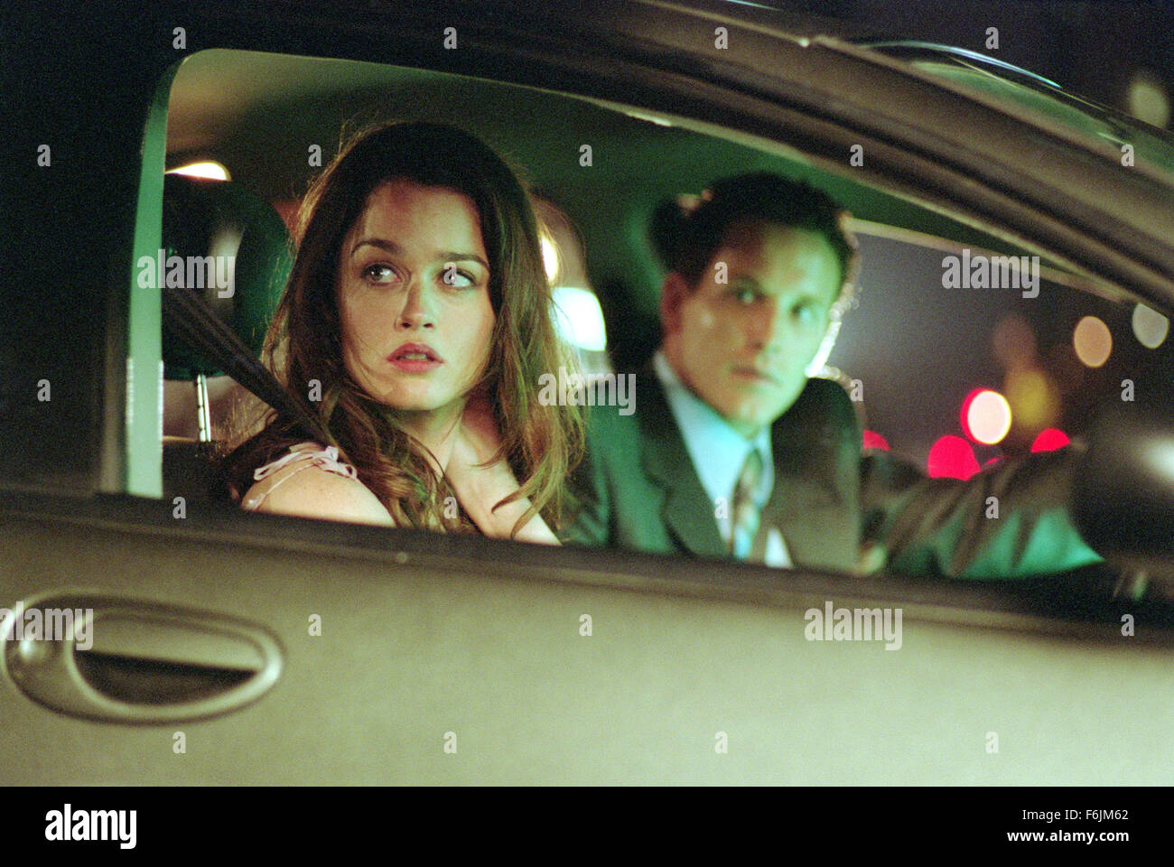 RELEASE DATE: September 3, 2004. MOVIE TITLE: Paparazzi. STUDIO: 20th Century Fox. PLOT: A rising Hollywood actor decides to take personal revenge against a group of four persistent photographers to make them pay for almost causing a personal tragedy involving his wife and son. PICTURED: ROBIN TUNNEY as Abby Laramie and COLE HAUSER as movie star Bo Laramie. Stock Photo