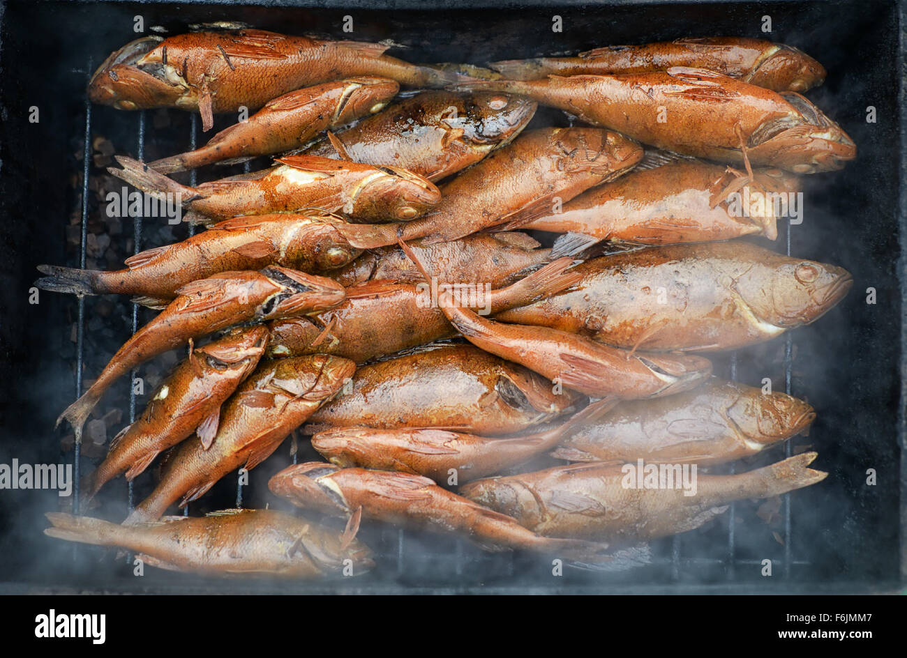 Fresh hot smoked fish on the grill Stock Photo
