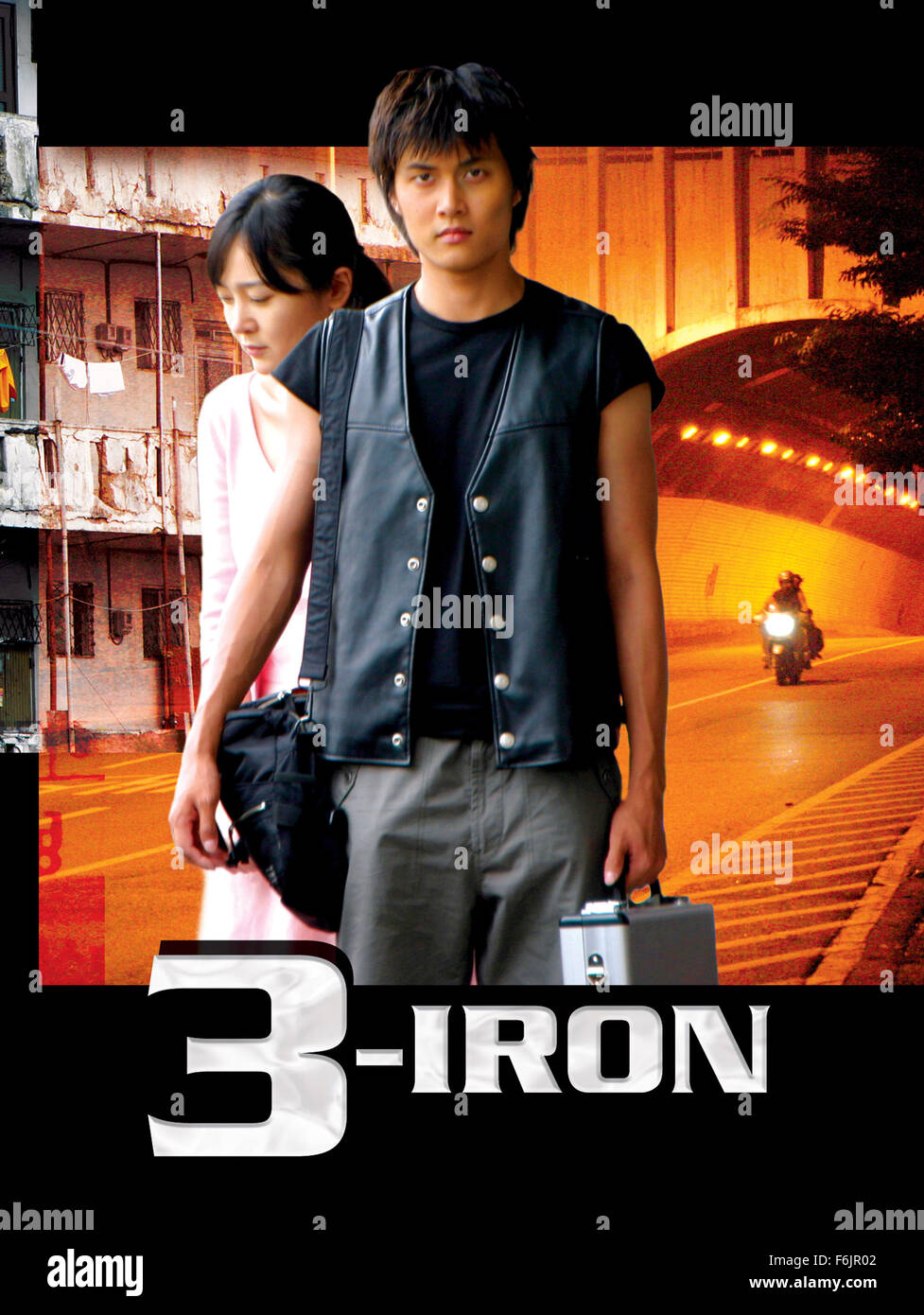RELEASE DATE: April 29, 2005. MOVIE TITLE: 3-Iron. STUDIO: Cineclick Asia. PLOT: A young drifter enters strangers' houses - and lives - while owners are away. He spends a night or a day squatting in, repaying their unwitting hospitality by doing laundry or small repairs. His life changes when he runs into a beautiful woman in an affluent mansion who is ready to escape her unhappy, abusive marriage. PICTURED: SEUNG-YEON LEE as Sun-hwa and HEE JAE as Tae-suk. Stock Photo