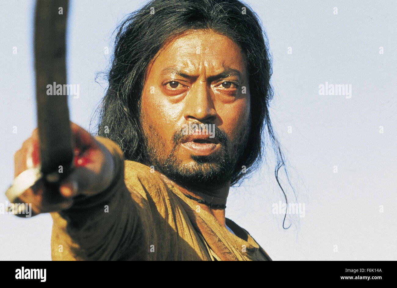 RELEASE DATE: July 15, 2005. MOVIE TITLE: The Warrior. STUDIO: Miramax Films. PLOT: In feudal India, a warrior (Khan) who renounces his role as the longitme enforcer to a local lord becomes the prey in a murderous hunt through the Himalayan mountains. PICTURED: IRFAN KHAN as Lafcadia. Stock Photo