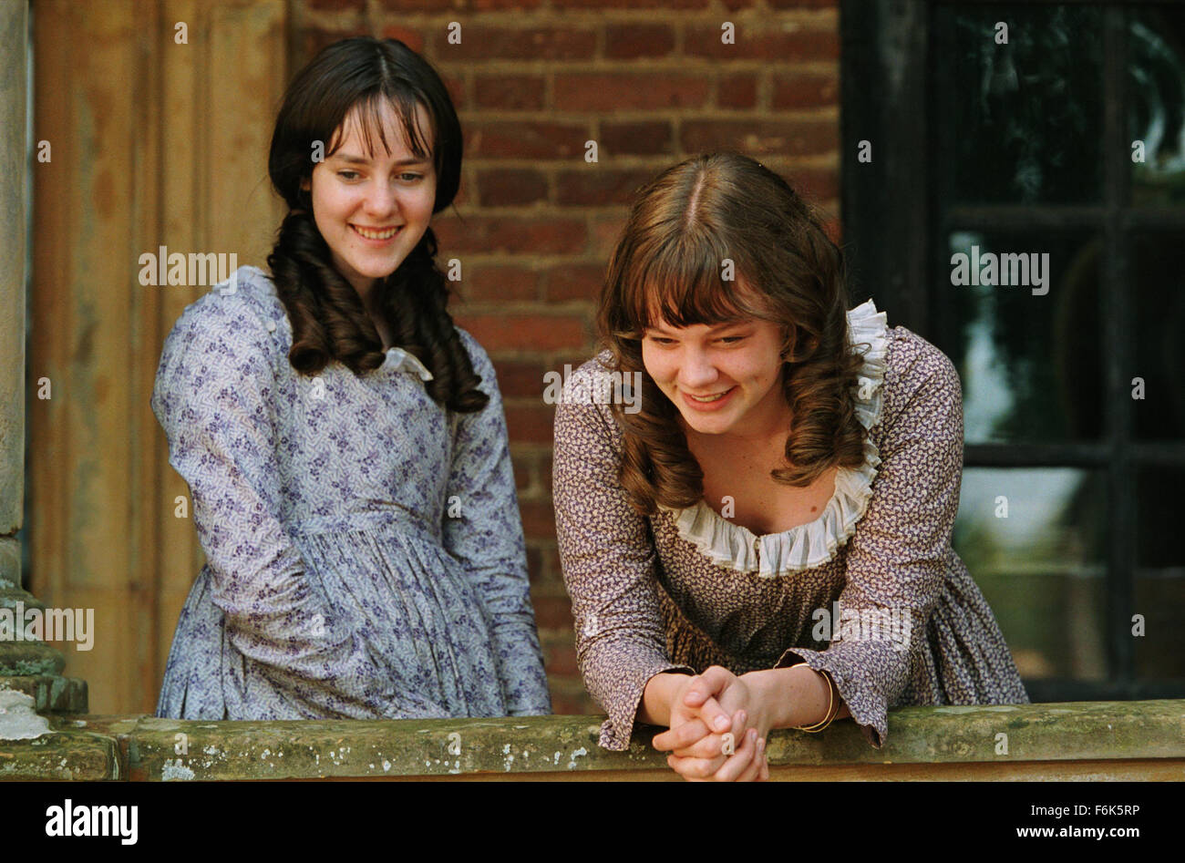 RELEASE DATE: November 23, 2005. MOVIE TITLE: Pride and Prejudice. STUDIO: Focus Features. PLOT: The story is based on Jane Austen's novel about five sisters - Jane, Elizabeth, Mary, Kitty and Lydia Bennet - in Georgian England. Their lives are turned upside down when a wealthy young man (Mr. Bingley) and his best friend (Mr. Darcy) arrive in their neighborhood. PICTURED: JENA MALONE (left) as Lydia Bennet and CAREY MULLIGAN (right) as Kitty Bennet. Stock Photo