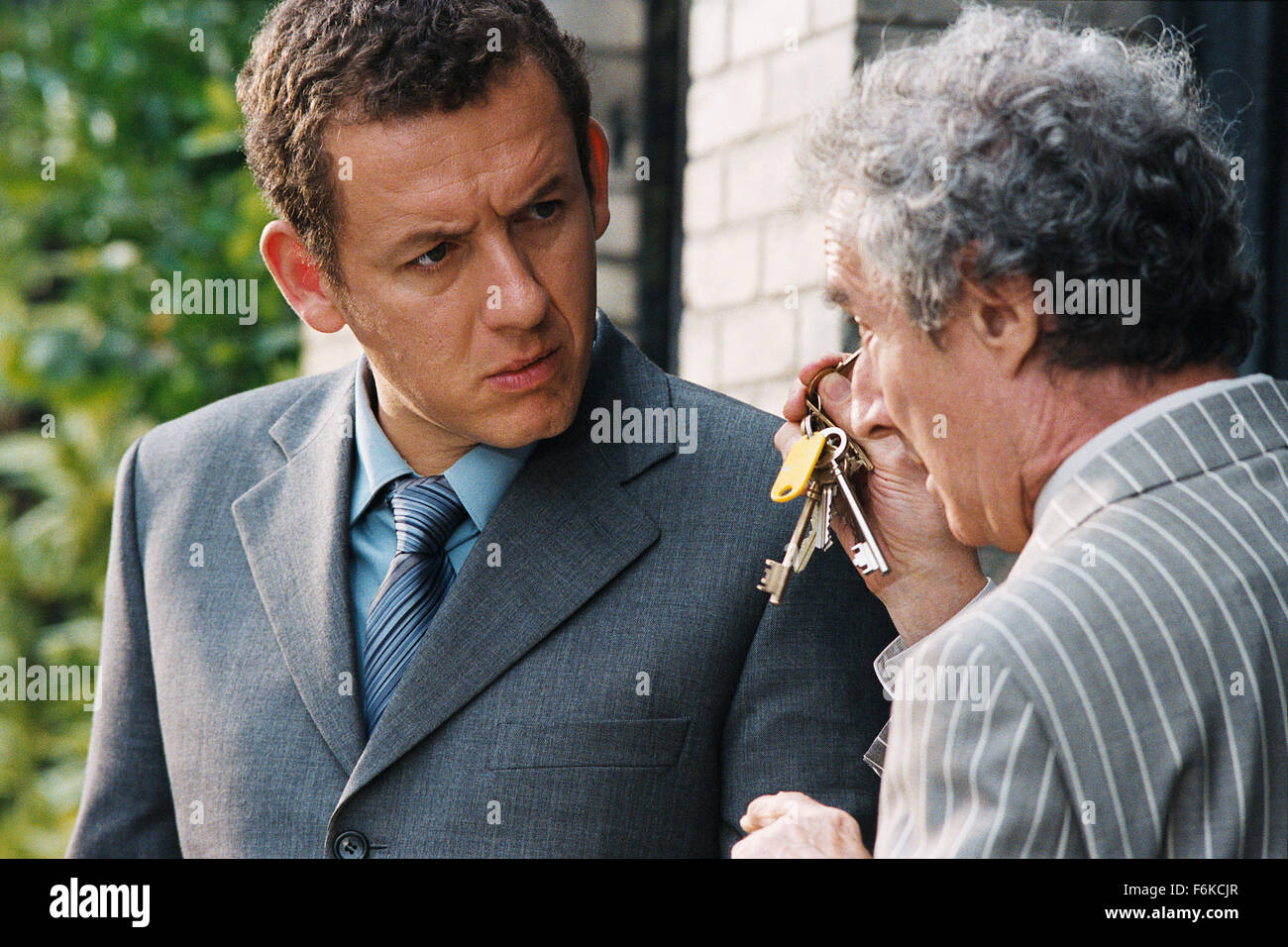 RELEASE DATE: June 07, 2006. MOVIE TITLE: La Maison Du Bonheur. STUDIO: Pathe Renn Productions. PLOT: On a mission to loosen up, a miser's sets about buying a house in the country for his family. PICTURED: DANY BOON as Charles Boulin and DANIEL PREVOST as Jean-Pierre Draquart. Stock Photo