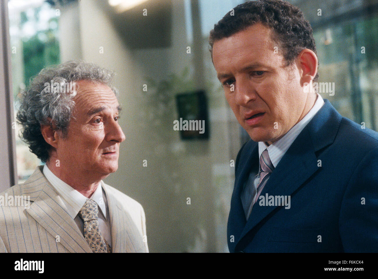 RELEASE DATE: June 07, 2006. MOVIE TITLE: La Maison Du Bonheur. STUDIO: Pathe Renn Productions. PLOT: On a mission to loosen up, a miser's sets about buying a house in the country for his family. PICTURED: DANIEL PREVOST as Jean-Pierre Draquart and DANY BOON as Charles Boulin. Stock Photo