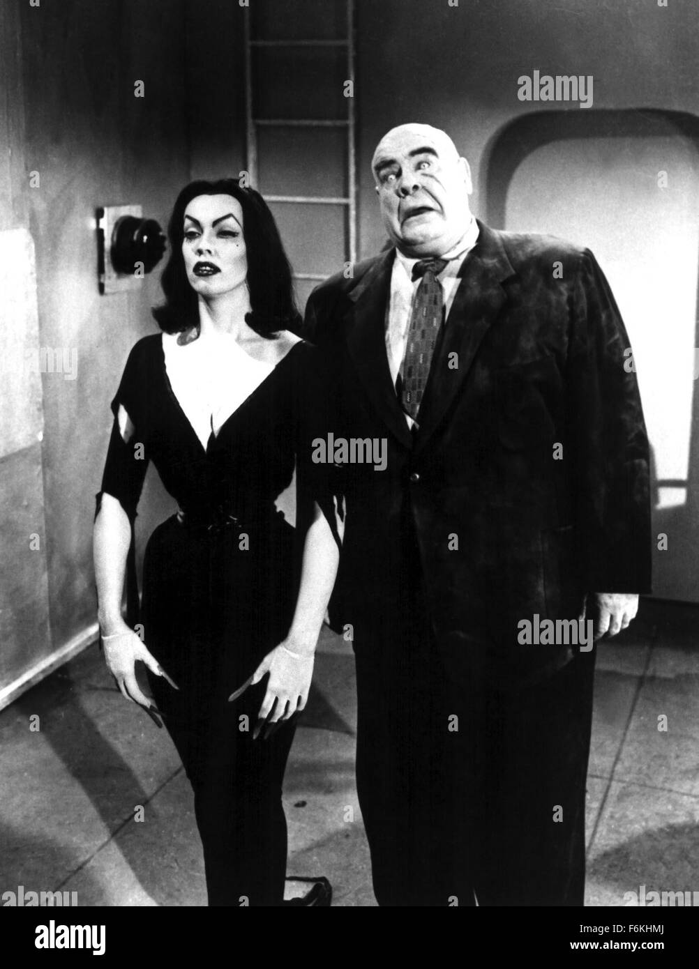 Nov 18, 2006; Hollywood, CA, USA; RELEASE DATE: 1959. DIRECTOR: Edward D. Wood Jr. STUDIO: Reynold's Pictures Inc. PLOT: Aliens resurrect dead humans as zombies and vampires to stop human kind from creating the Solaranite (a sort of sun-driven bomb). PICTURED: VAMPIRA and TOR JOHNSON.   Mandatory Credit: Photo by Reynold's Pictures. (c) Copyright 2006 by Reynold's Pictures Stock Photo