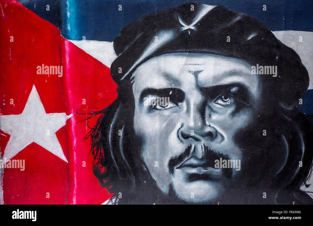 Ernesto Che Guevara image and painting, before Cuban Flag, Oil Painting of Che, souvenirs, Street Scene, La Habana, Cuba Stock Photo