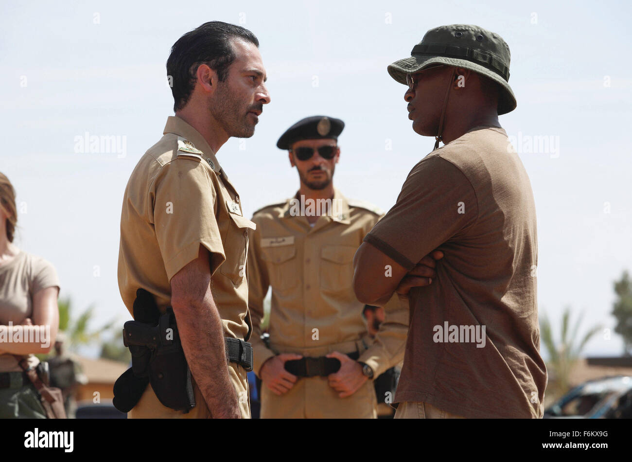 RELEASE DATE: September 28, 2007. MOVIE TITLE: The Kingdom - STUDIO: Universal Pictures. PLOT: A team of U.S. government agents is sent to investigate the bombing of an American facility in the Middle East. PICTURED: (L-R) ASHRAF BARHOM as Saudi Colonel Al Ghazi, ALI SULIMAN as Saudi Sergeant Haytham and JAMIE FOXX as FBI team leader Ronald Fleury. Stock Photo