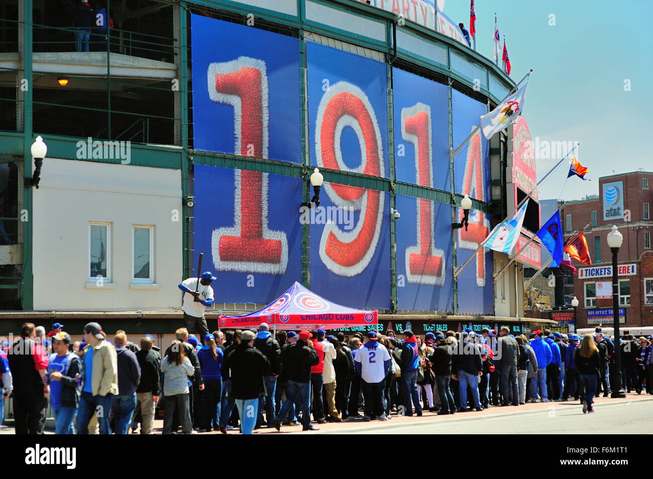 Fans line up in large numbers waiting to enter the main entrance at Wrigley Field, the home of the Chicago Cubs. Chicago, Illinois, USA. Stock Photo