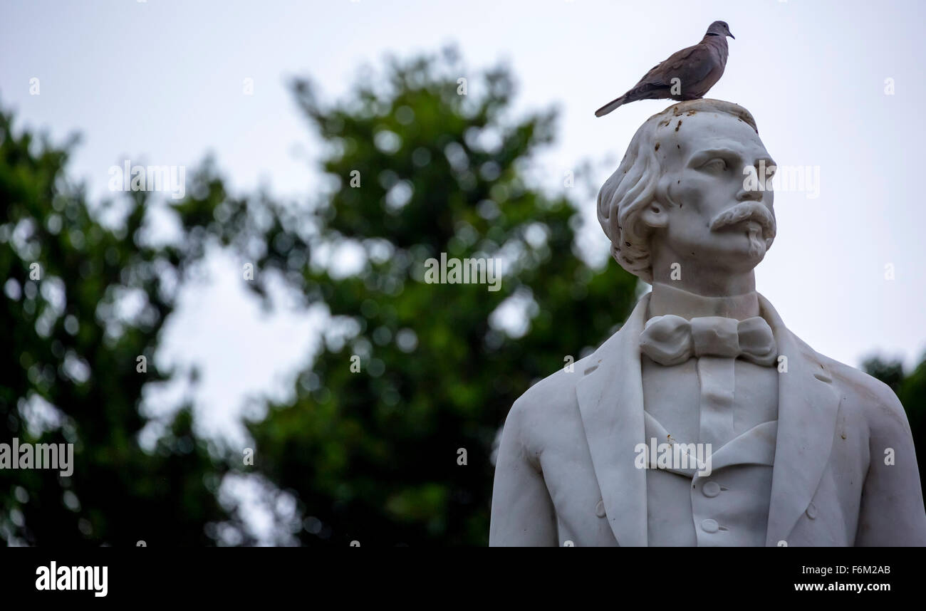 Marble statue from the first President of the Republic of Cuba after independence Carlos Manuel de Céspedes with pigeon Stock Photo