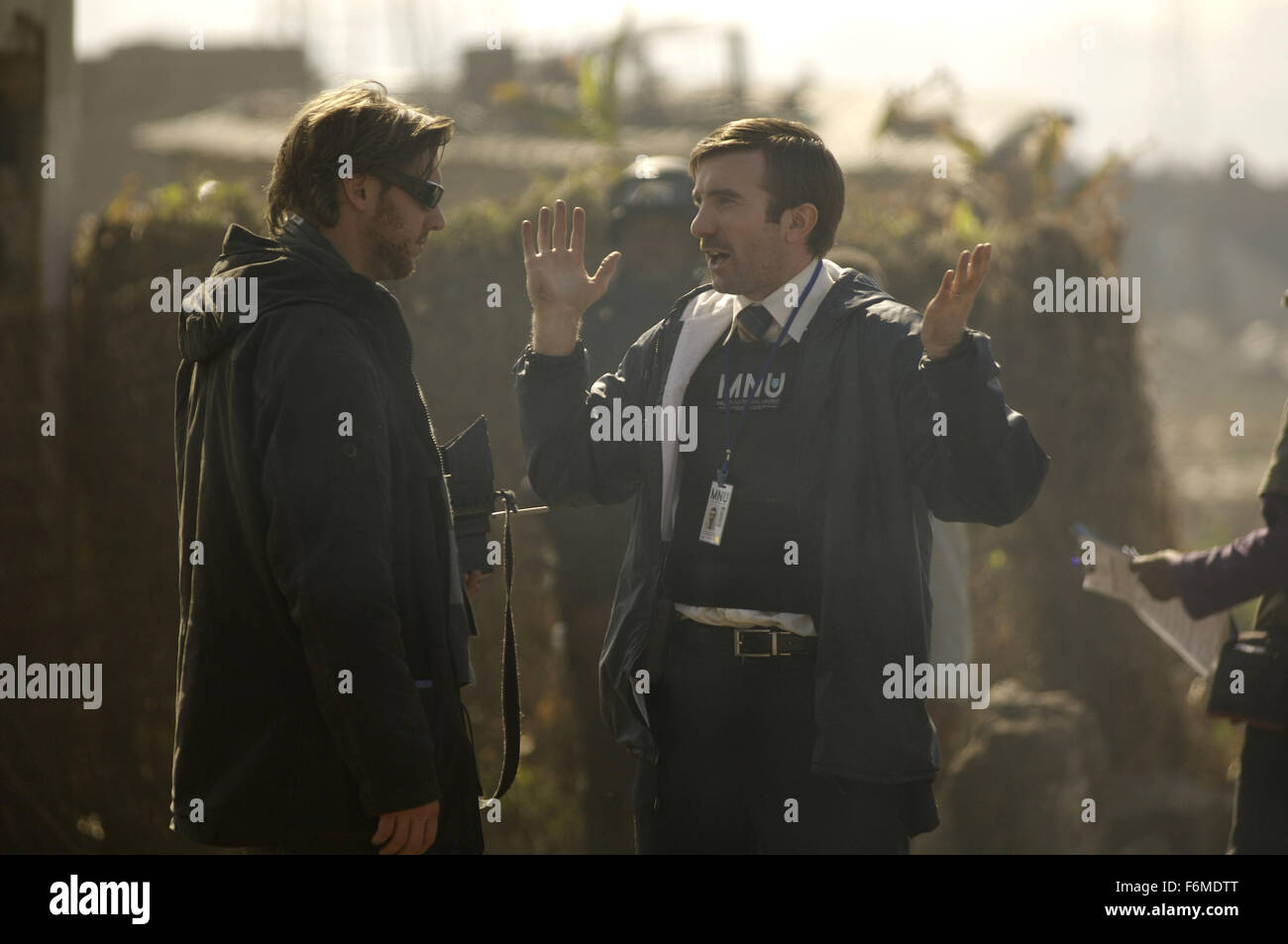 RELEASE DATE: August 14, 2009. MOVIE TITLE: District 9. STUDIO: Sony Pictures. PLOT: An extraterrestrial race forced to live in slum-like conditions on Earth suddenly find a kindred spirit in a government agent that is exposed to their biotechnology. PICTURED: Director NEILL BLOMKAMP (left) and SHARLTO COPLEY on the set Stock Photo
