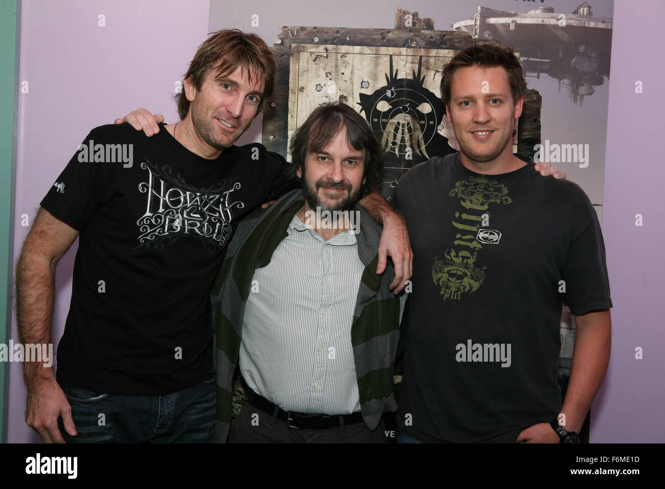 RELEASE DATE: August 19, 2009. MOVIE TITLE: District 9. STUDIO: TriStar Pictures. PLOT: An extraterrestrial race forced to live in slum-like conditions on Earth suddenly finds a kindred spirit in a government agent who is exposed to their biotechnology. PICTURED: Sharlto Copley, Producer PETER JACKSON and Director NEILL BLOMKAMP Stock Photo