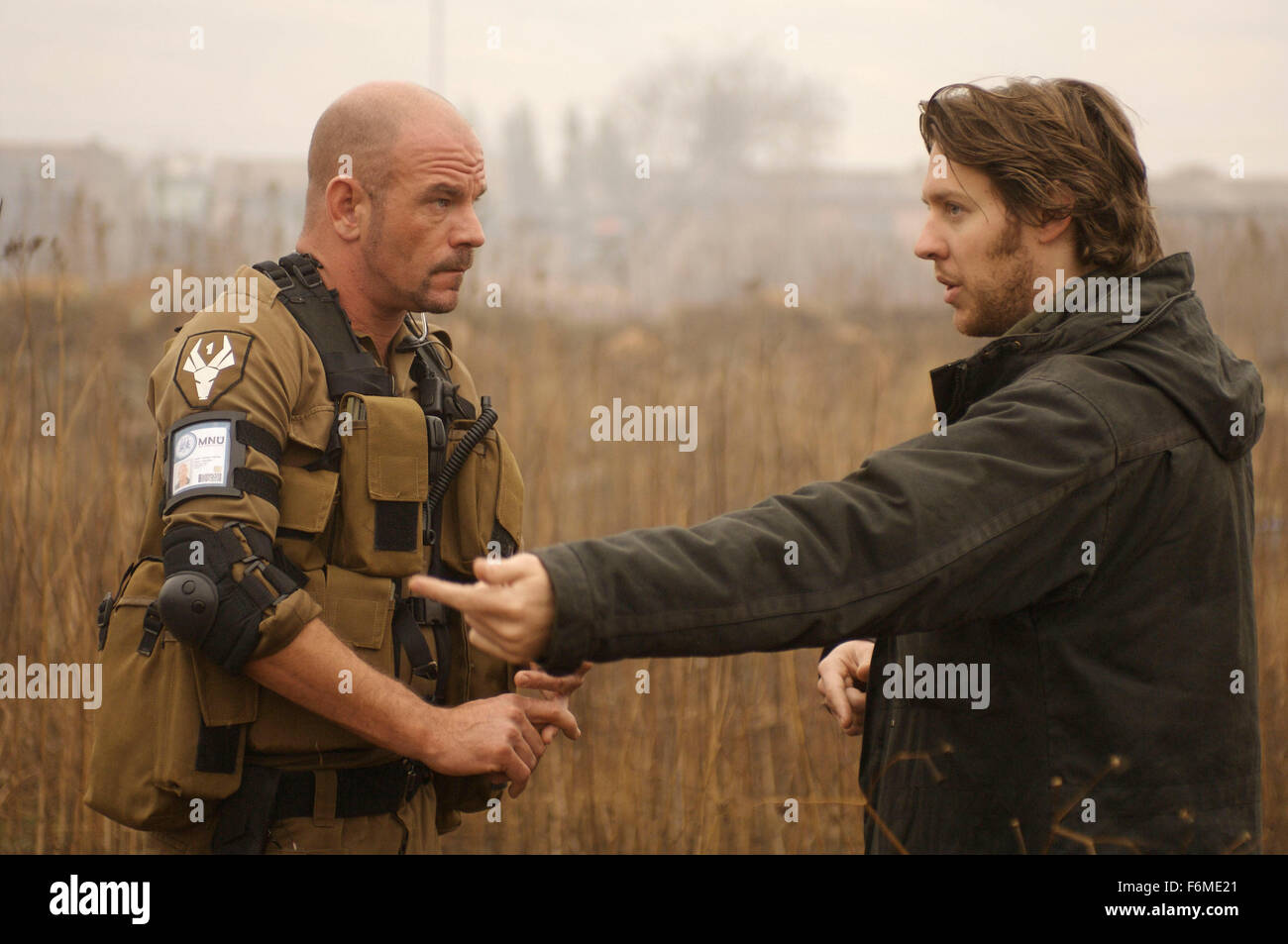 RELEASE DATE: August 19, 2009. MOVIE TITLE: District 9. STUDIO: TriStar Pictures. PLOT: An extraterrestrial race forced to live in slum-like conditions on Earth suddenly finds a kindred spirit in a government agent who is exposed to their biotechnology. PICTURED: DAVID JAMES (left) and Director NEILL BLOMKAMP on the set Stock Photo