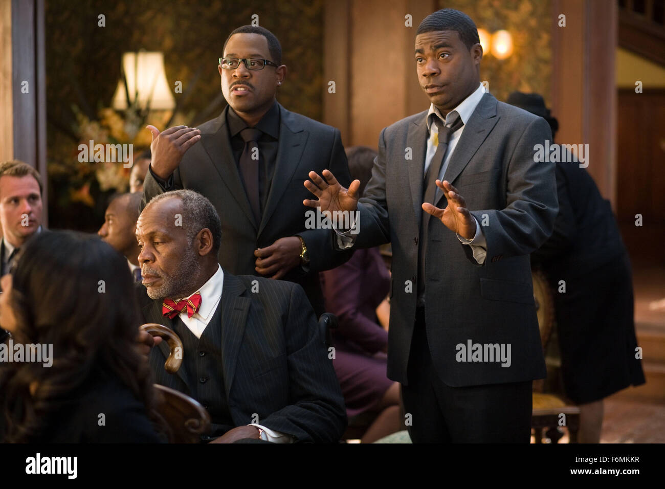 RELEASE DATE: April 16, 2010. MOVIE TITLE: Death At A Funeral. STUDIO: . PLOT: A funeral ceremony turns into a debacle of exposed family secrets and misplaced bodies.. PICTURED: MARTIN LAWRENCE as Ryan, TRACY MORGAN (R) as Norman and DANNY GLOVER as Uncle Russell. Stock Photo