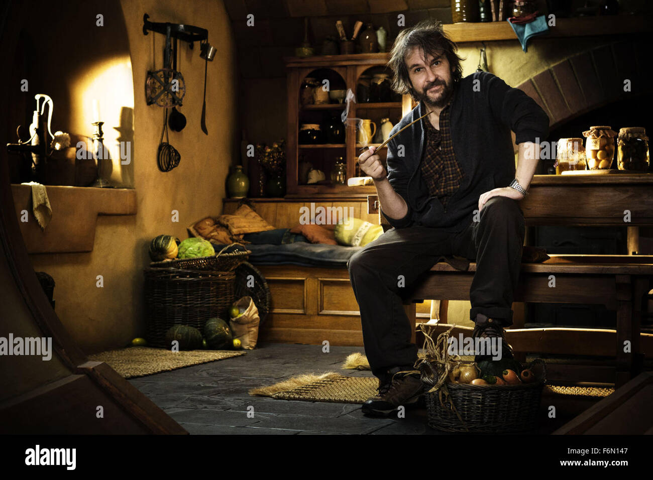 RELEASE DATE: December 14, 2012 TITLE: The Hobbit: An Unexpected Journey STUDIO: MGM DIRECTOR: Peter Jackson PLOT: A curious Hobbit, Bilbo Baggins, journeys to the Lonely Mountain with a vigorous group of Dwarves to reclaim a treasure stolen from them by the dragon Smaug. PICTURED: Director PETER JACKSON on set (Credit: c Walt Disney Pictures/Entertainment Pictures) Stock Photo
