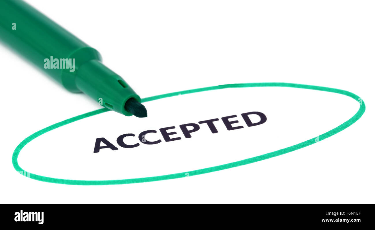ACCEPTED written in a white paper and a green sign pen Stock Photo