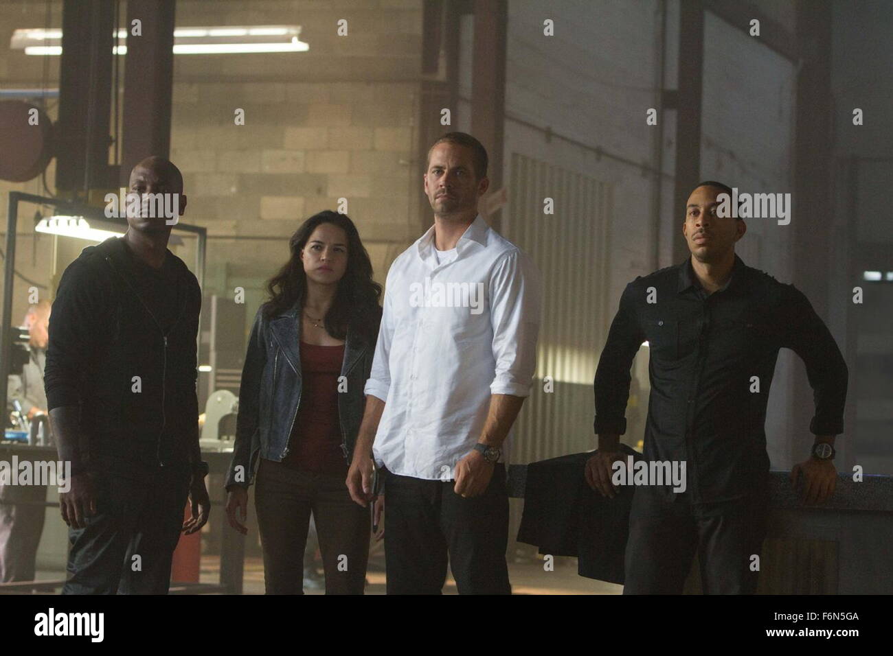 RELEASE DATE: April 3, 2015 TITLE: Furious 7 STUDIO: Universal Picures DIRECTOR: James Wan PLOT: Deckard Shaw seeks revenge against Dominic Toretto and his family for the death of his brother PICTURED: TYRESE GIBSON as Roman Pearce, MICHELLE RODRIGUEZ as Letty Ortiz, PAUL WALKER as Brian O'Conner and LUDACRIS as Tej Parker (Credit: c Universal Picures/Entertainment Pictures) Stock Photo