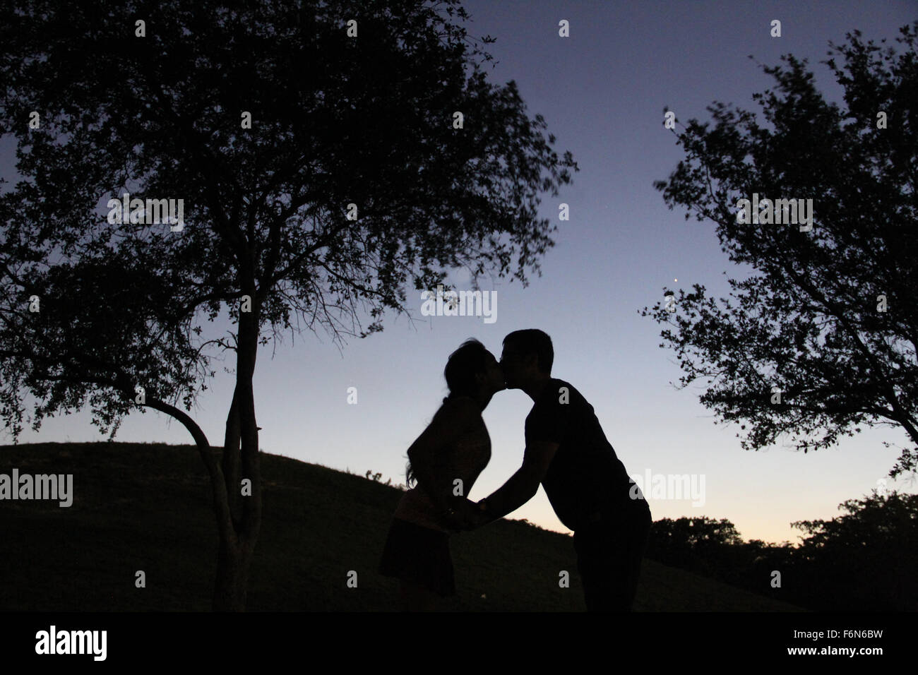 Kiss Under The Night Sky Stock Photo Alamy