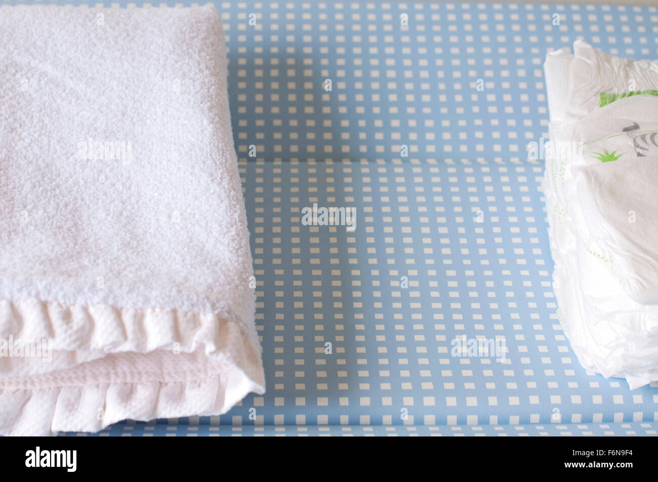Changing table with diapers and towel for baby care Stock Photo Alamy