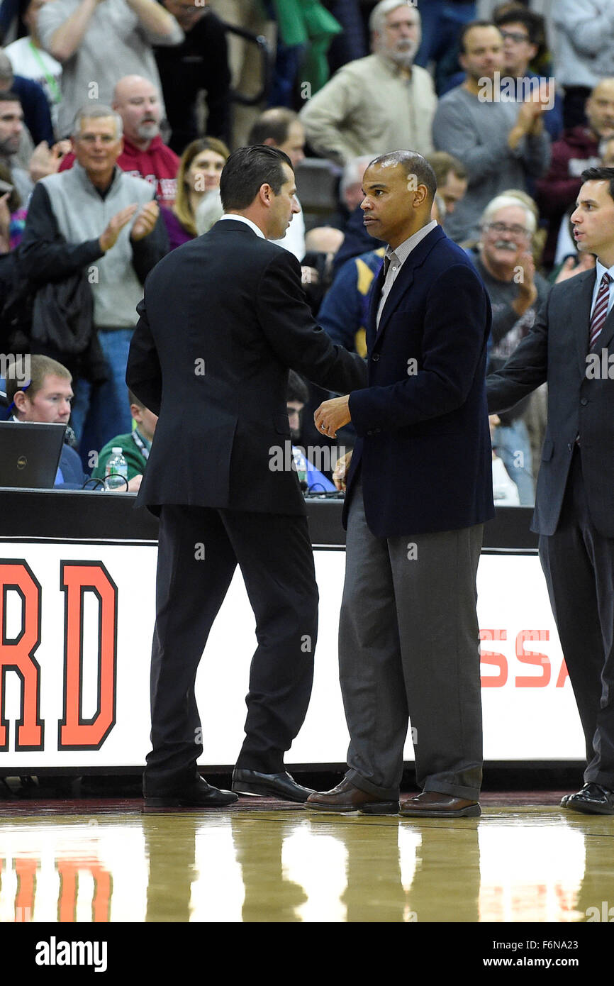 Tuesday, November 17, 2015: Massachusetts Minutemen head coach Derek Kellogg (left) and Harvard Crimson head coach Tommy Amaker (right) shake hands at the end of the NCAA basketball game between the Massachusetts Minutemen and the Harvard Crimson held at the Lavietes Pavilion in Boston, Massachusetts. Massachusetts defeats Harvard 69-63 in regulation time. Eric Canha/CSM Stock Photo