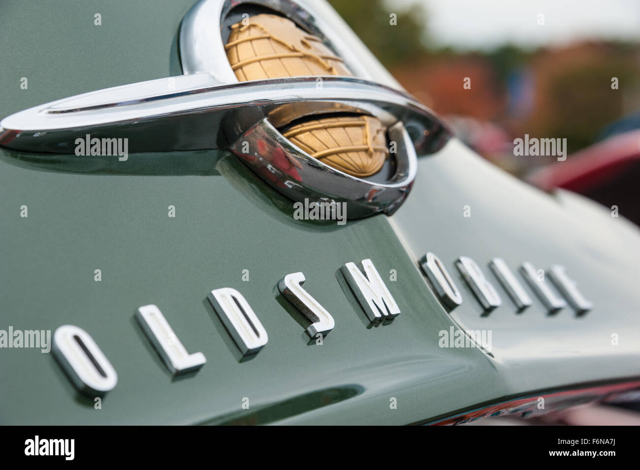 Oldsmobile hood emblem on a beautifully restored vintage automobile. Stock Photo