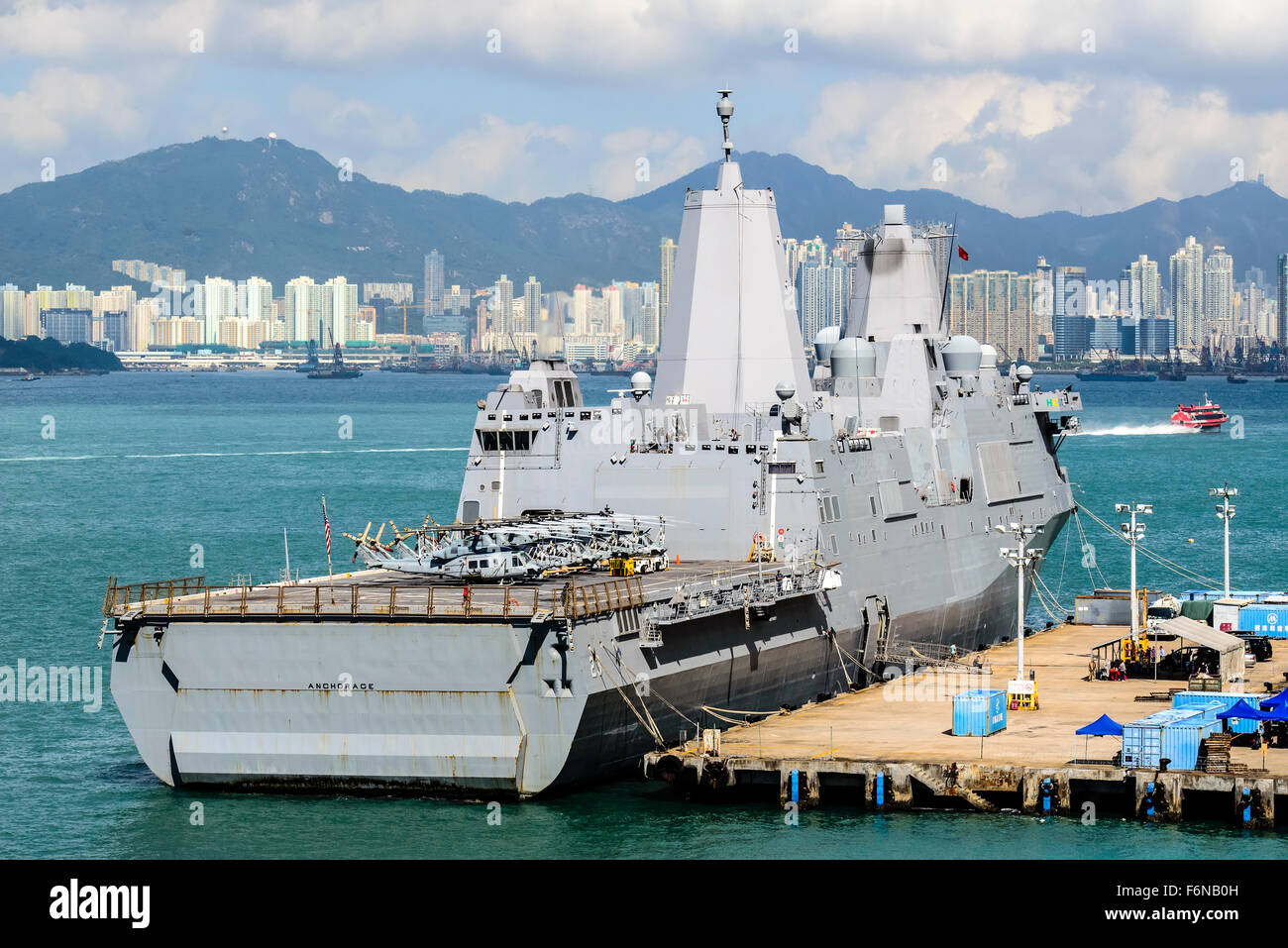 The USS Anchorage, San Antonio-class amphibious transport dock ship docked in Hong Kong, Victoria harbour, Hong Kong, China. Stock Photo