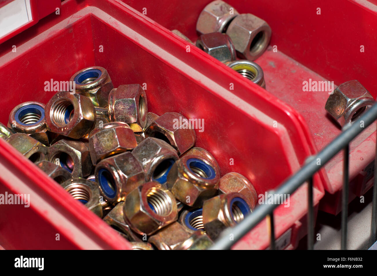 Nuts in a drawer from a spare parts store Stock Photo