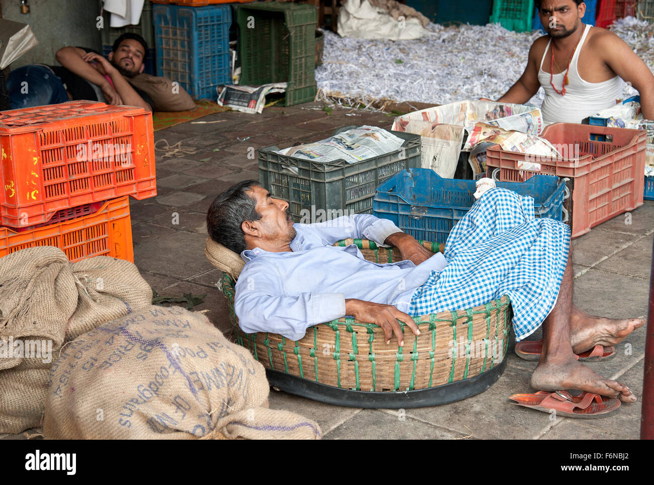 The image of man sleeping was taken in Crawford market, Mumbai, India Stock Photo