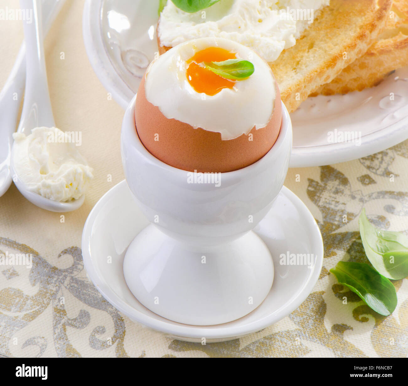 Healthy breakfast - soft boiled egg with toast and herb - healthy