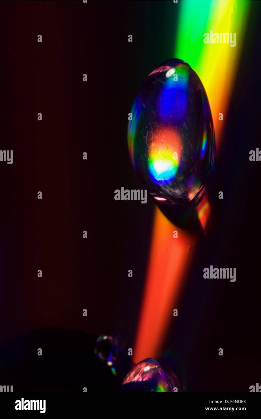 rainbow drop in a plastic cd material abstract Stock Photo - Alamy