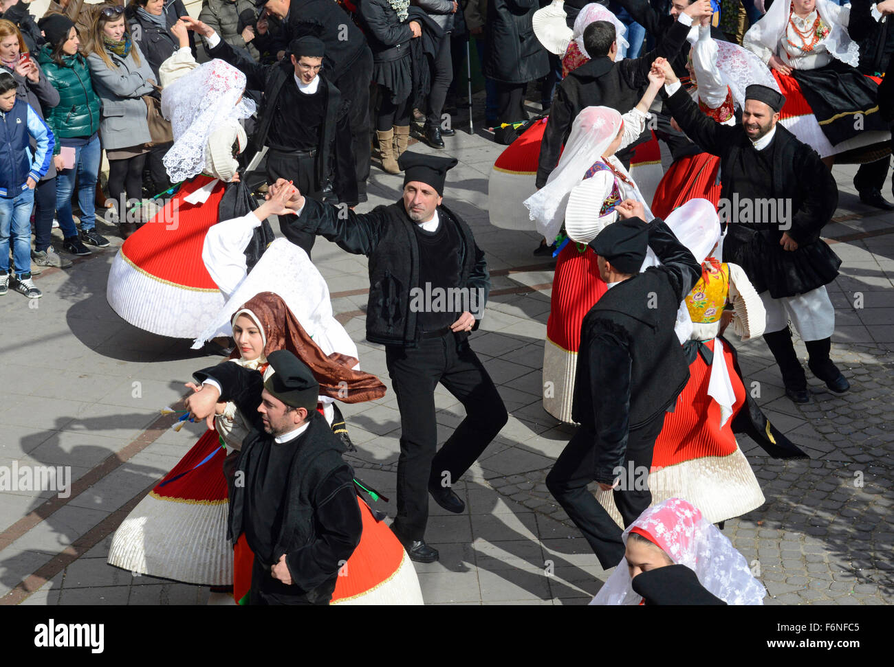 sardinian people in traditional clothes during a dance in Carnival