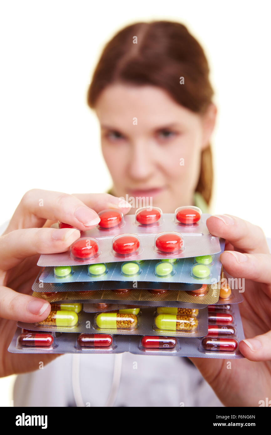 Female doctor holding many colorful pills in her hands Stock Photo