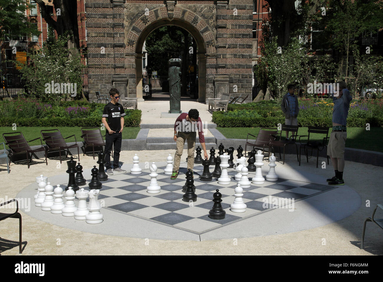 Young people playing chess at the Rijksmuseum park Amsterdam Stock Photo