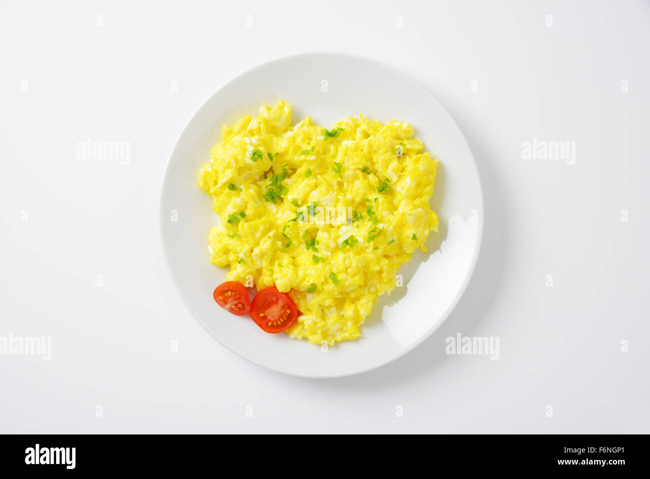 plate of scrambled eggs isolated on white background, top view Stock Photo  - Alamy