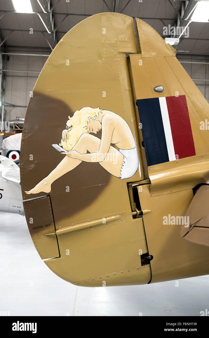 Pin-up mascot on tail fin of a Mustang fighter from the 1940s Stock Photo