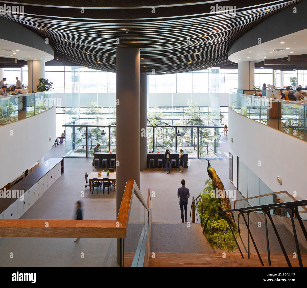 View from upper floor towards entrance hall. BreadTalk IHQ, Singapore, Singapore. Architect: Kay Ngeee Tan Architects, 2014. Stock Photo