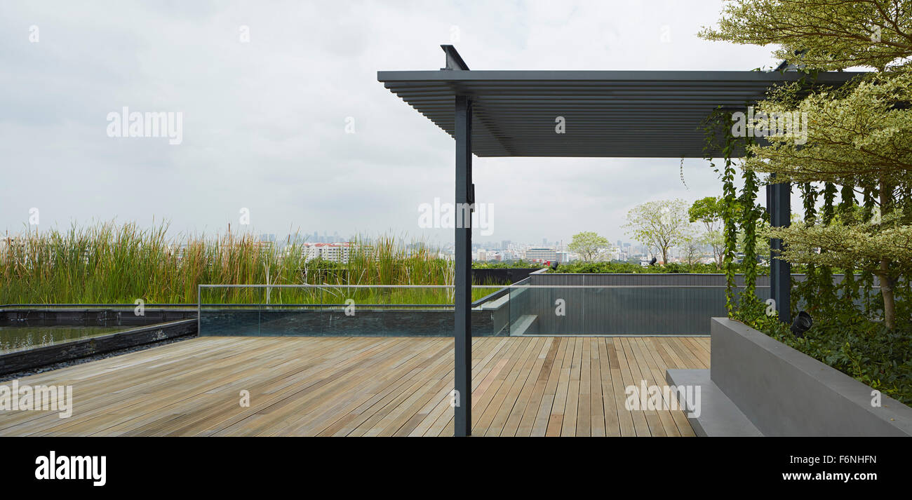 Timber decked roof terrace. BreadTalk IHQ, Singapore, Singapore. Architect: Kay Ngeee Tan Architects, 2014. Stock Photo