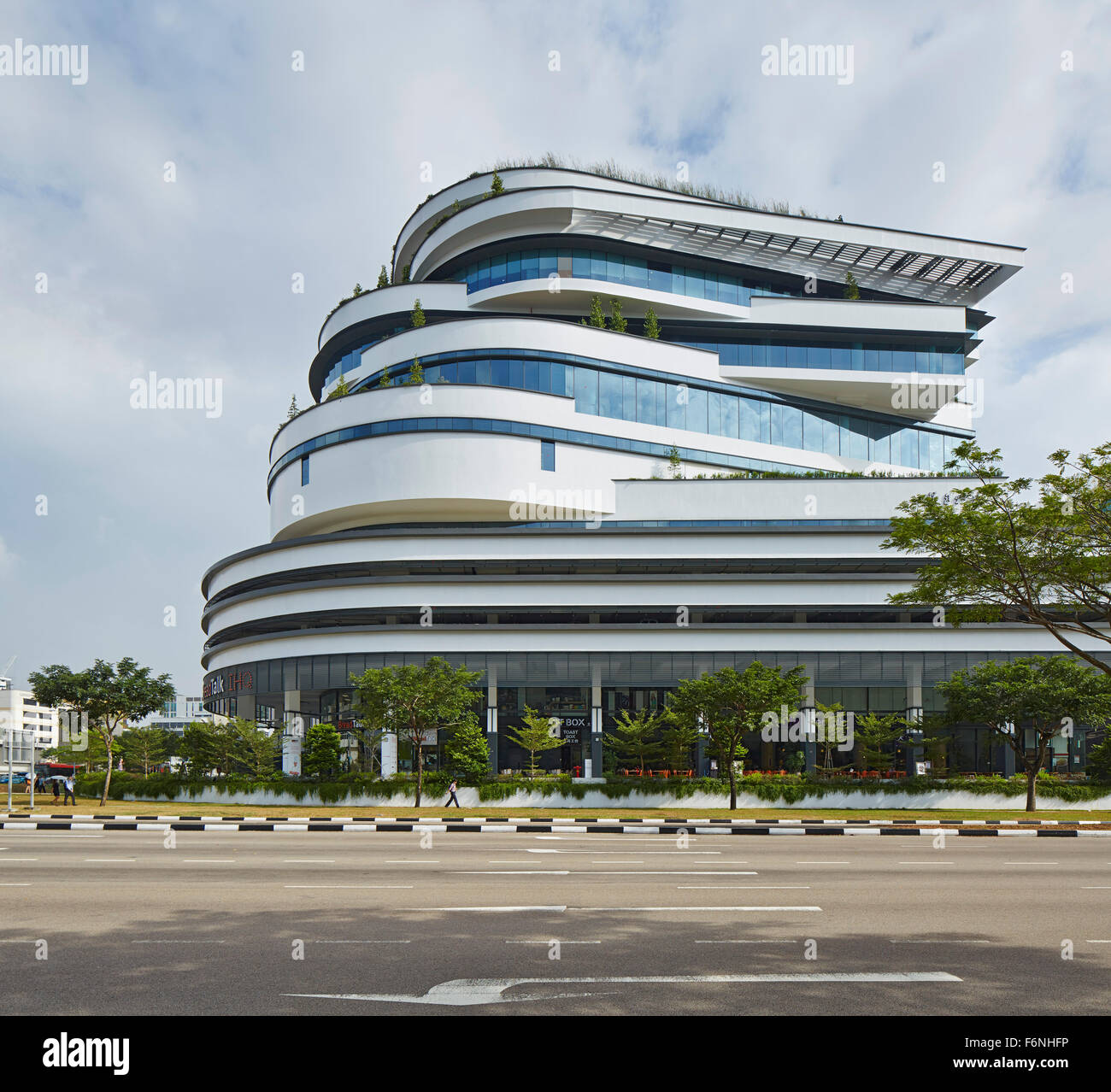 Side elevation across street. BreadTalk IHQ, Singapore, Singapore. Architect: Kay Ngeee Tan Architects, 2014. Stock Photo