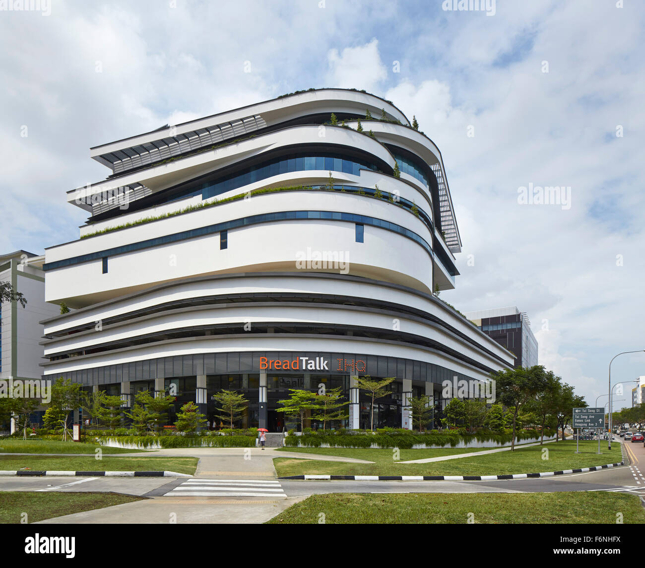 General elevation with landscaped approach. BreadTalk IHQ, Singapore, Singapore. Architect: Kay Ngeee Tan Architects, 2014. Stock Photo