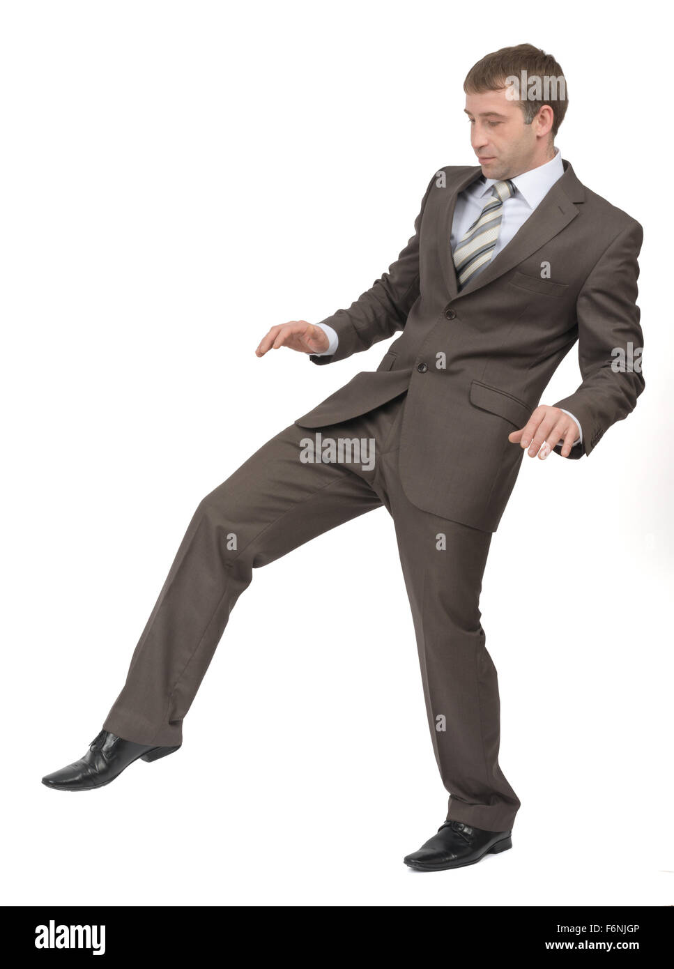Businessman walking gingerly Stock Photo Alamy