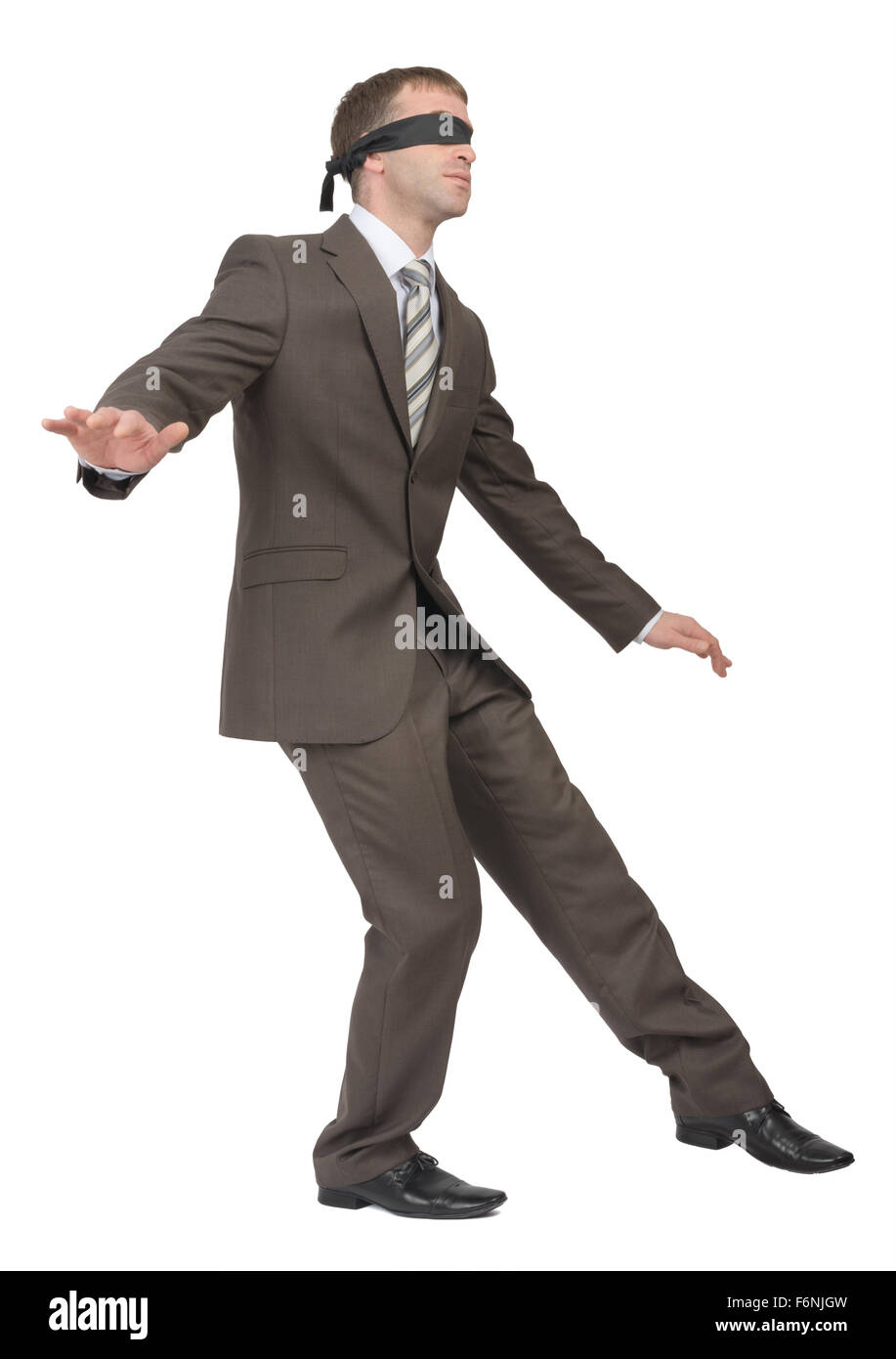 Man walking gingerly with band on his eyes Stock Photo Alamy