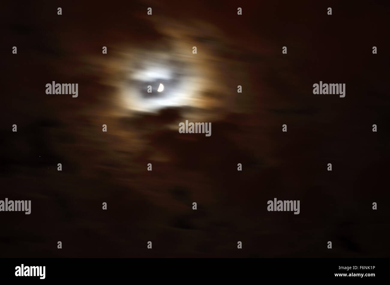 full moon on cloudy night sky Stock Photo - Alamy