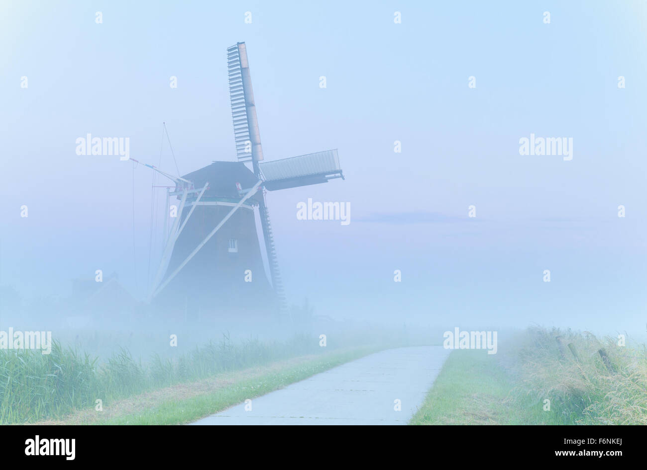 charming windmill in dense fog, Netherlands Stock Photo Alamy