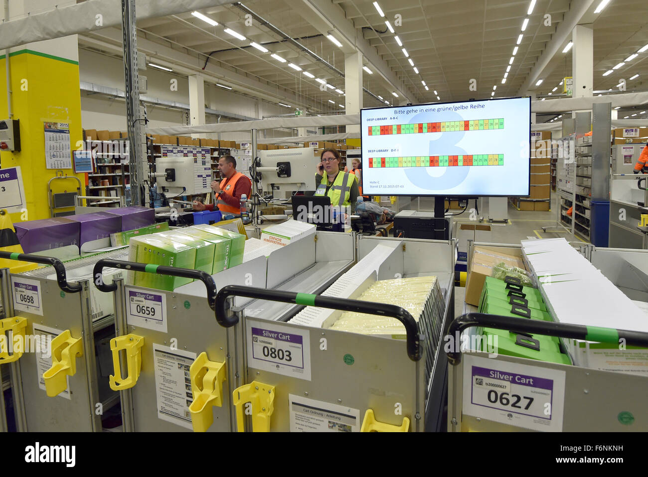 Brieselang, Germany. 17th Nov, 2015. A staff member organises mail orders  at the logistics centre of online retailer Amazon in Brieselang, Germany,  17 November 2015. The logistics centre in Brieselang is Amazon's