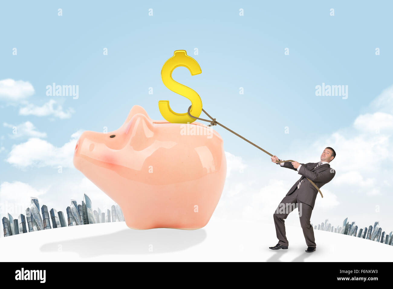 Businessman holding dollar sign with rope and city Stock Photo - Alamy