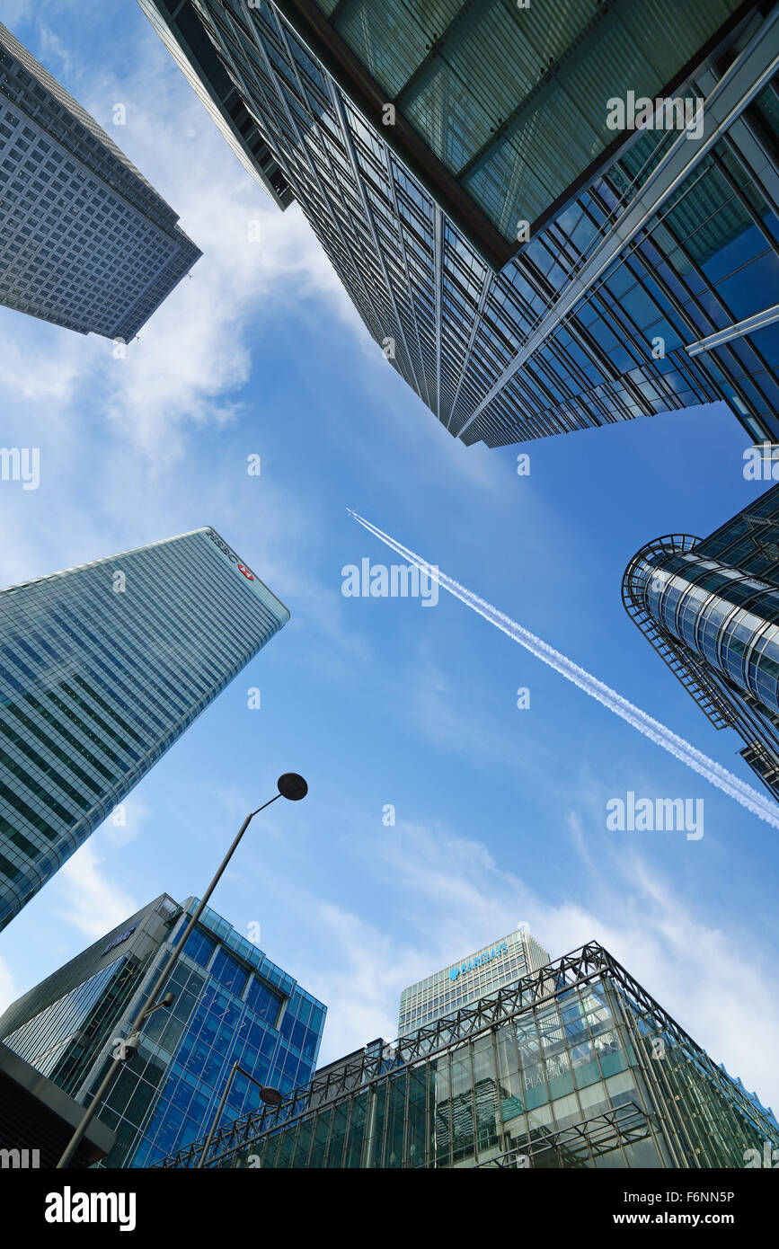 Airplane Flying Over Skyscrapers, Canary Wharf, London, England, UK Stock Photo