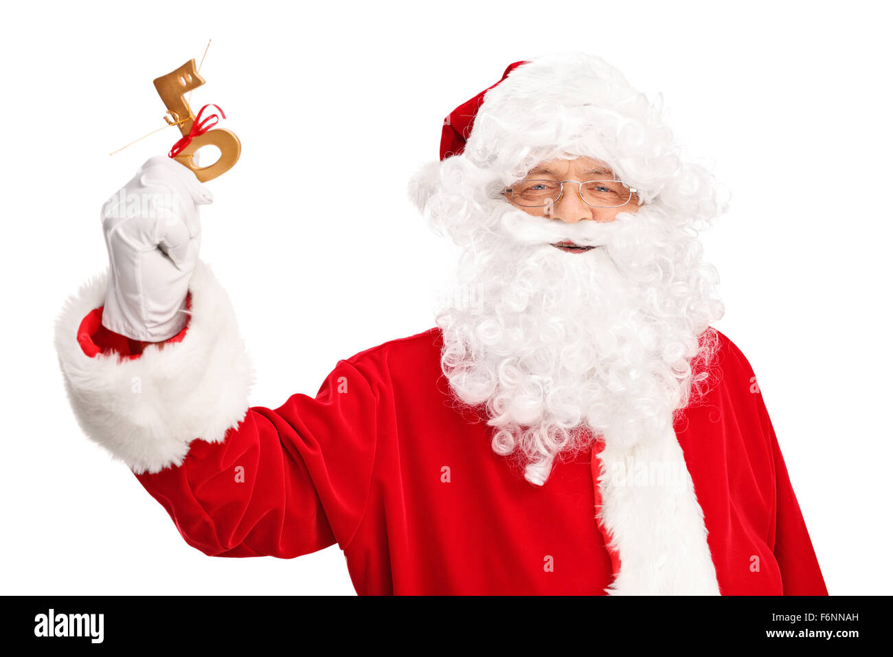 Studio shot of Santa Claus holding a key wrapped with red ribbon isolated on white background Stock Photo
