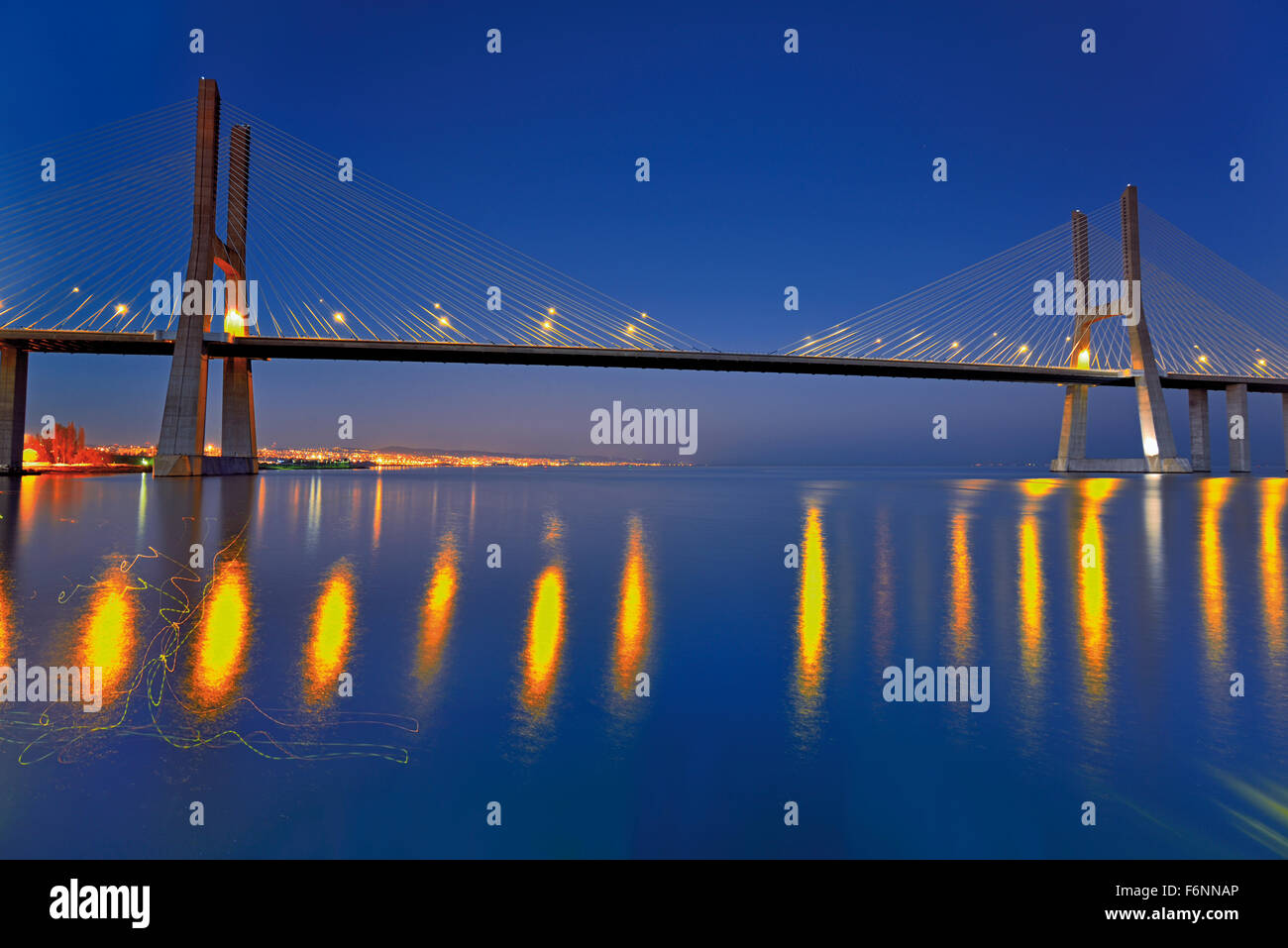 Portugal: Nocturnal view of Vasco da Gama bridge over river Tagus Stock Photo