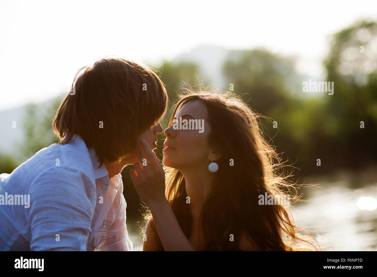Close up brunette male female kissing hi-res stock photography and ...