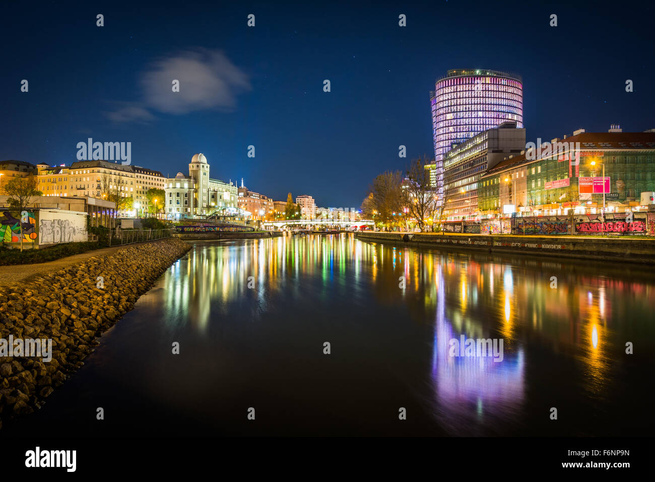 Buildings along the Danube Canal at night, in Vienna, Austria. Stock Photo
